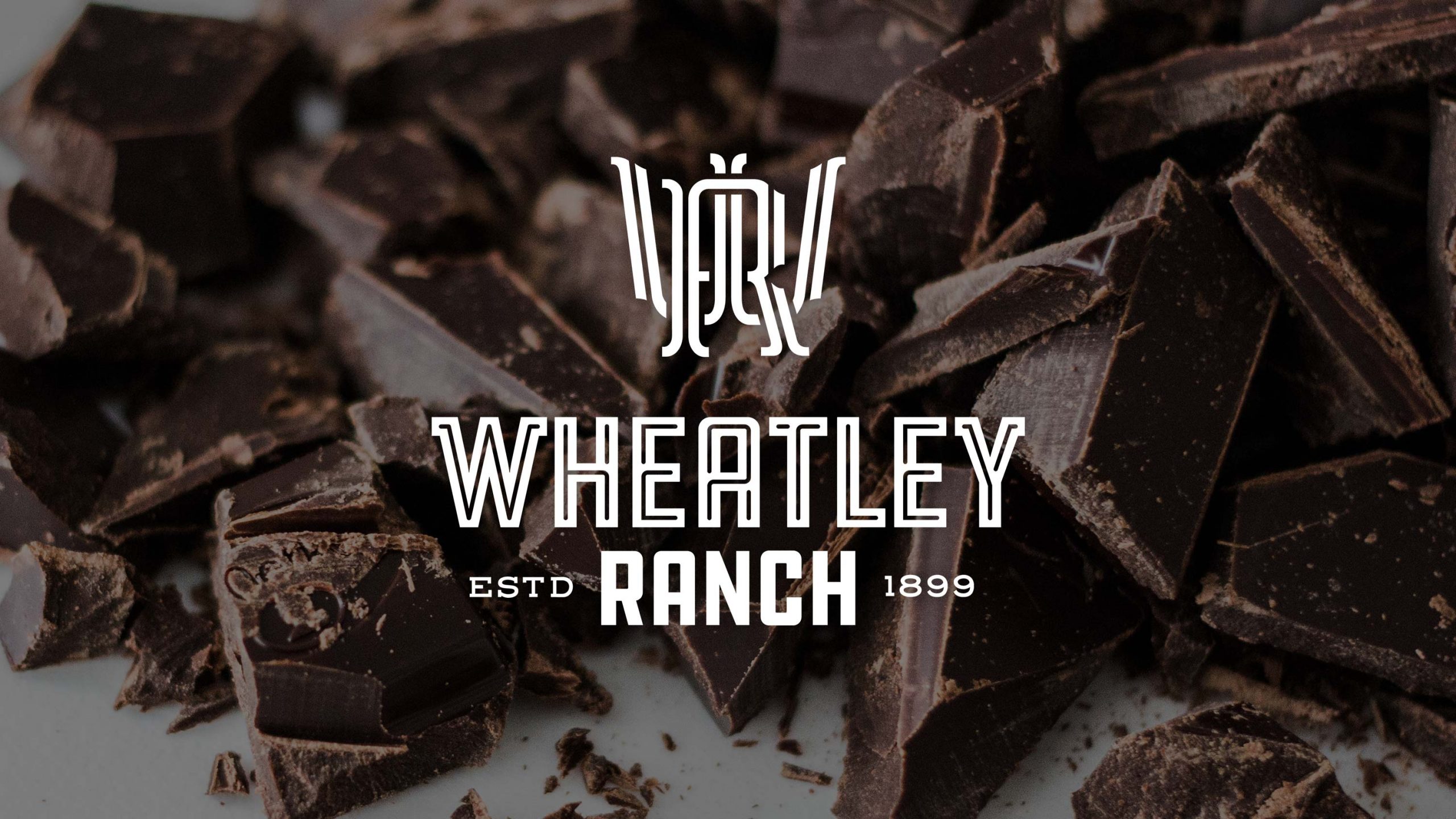 wheatley-wheatley-logo-over-heap-of-chocolate-pieces-designhouse